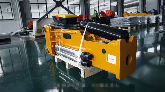 Top-type hydraulic breaker on a wooden pallet in a factory